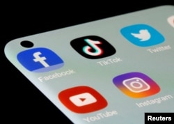 ILLUSTRATION - Facebook, TikTok, Twitter, YouTube, and Instagram logos on a smartphone screen, July 13, 2021. (Dado Ruvic/REUTERS)